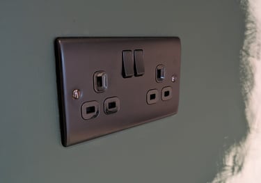 a black and white electrical outlet in a wall