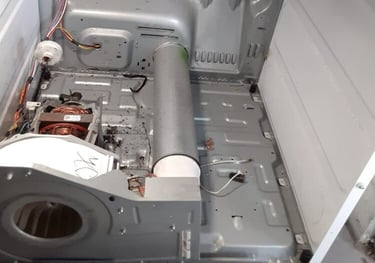 dryer taken a part and showing an exposed heating element