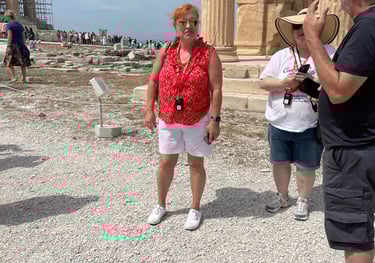 Picture of Teva leading a travel group through the Acropolis in Athens, Greece.