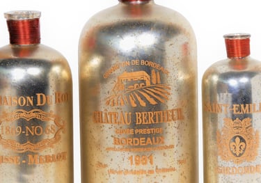 three old fashioned glass designer bottles for table top