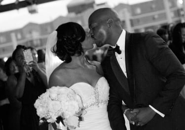 Groom and Bride kissing. Root top wedding at the Rockville Arts & Innovation Center, Rockville, MD