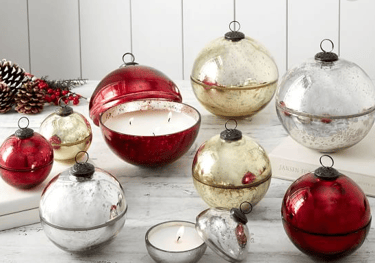 a group of christmas ornaments and candles