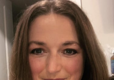 a woman with a blue dress and a black top