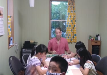 students and teacher in a home classroom