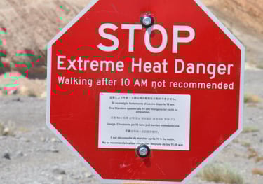 a stop sign warning of extreme heat at zabreski point, Death Valley