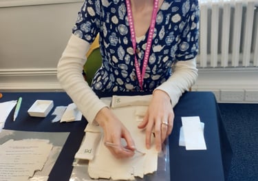 Mandy conserving a paper document