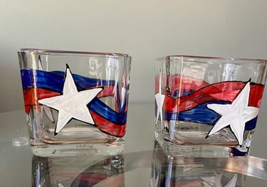 two glasses candle with a american patriotic flag on them
