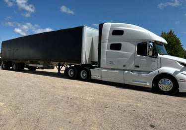 Transport Trucks on site delivering equipment to a festival.