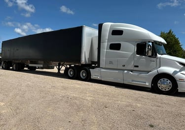Transport Trucks on site delivering equipment to a festival.