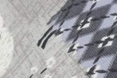 A roman blind with a side tab to hide the end of the headrail