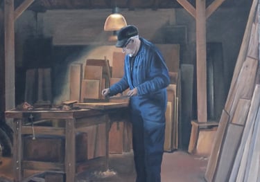 Détail fresque sur façade à Moirans-en-Montagne: un menuisier travaille dans son atelier.