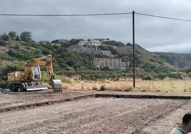 Bulldozer leveling a field