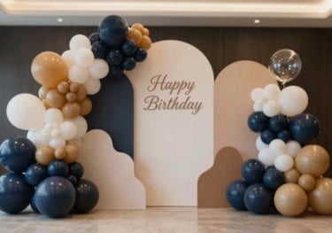 Professional balloon art installation featuring organic shapes and sophisticated color palettes for a birthday celebration.
