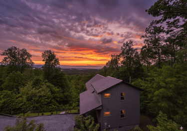Exterior view of a secluded log cabin tucked away in the wooded Timberidge community near Gatlinburg