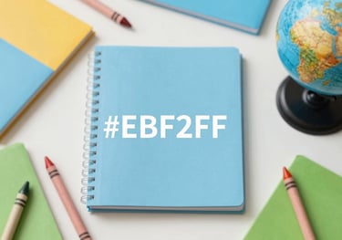 A flat-lay composition of colorful kindergarten workbooks with crayons and a small globe. Bright, cheerful lighting highlighting brand colors #EBF2F6 and #9EB7C2.