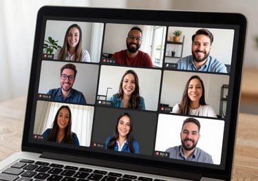 Close-up of a laptop screen showing a Zoom meeting with several smiling faces of parents and a professional moderator, indoor South American home office.