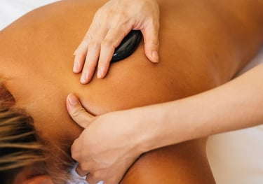 a woman getting a hot stone massage