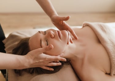 a woman getting a massage at a spa
