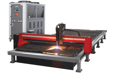 Industrial CNC plasma cutting machine with sparks and a process chiller behind