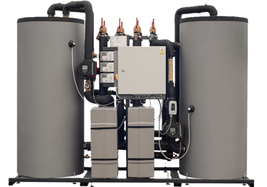Industrial heat recovery system with dual storage tanks and Grundfos circulation pumps.