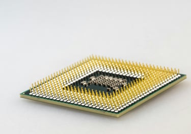 Lifestyle image of a gold colored computer processing chip.