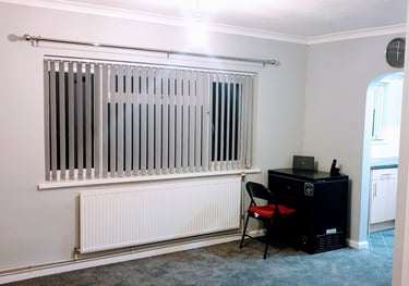 a vertical blind and curtain pole fitted in Lymington