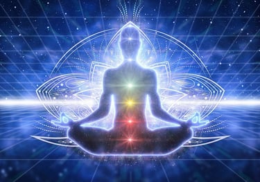 a person sitting in a lotus flower pose with chakras illuminated