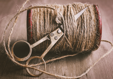 a pair of scissors and a spool of twine twine twine twin
