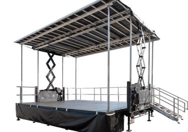 Portable mobile stage with a roof canopy and stairs for outdoor events and concerts.