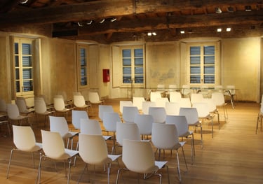 a room with chairs and chairs and a table
