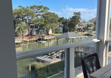 A beautiful view from a screen porch on the creek.