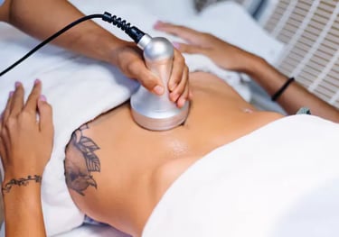 a woman getting a tattoo on her stomach