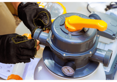 A pool tech is preparing to install the pool filterer