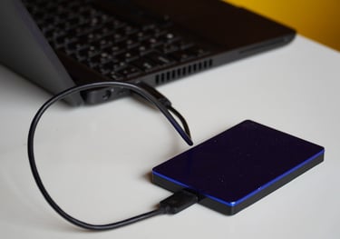 a laptop computer and external hard drive