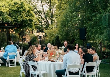 wedding guests eating pizza at a round table