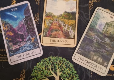 3 tarot cards the star, the sun, the empress
