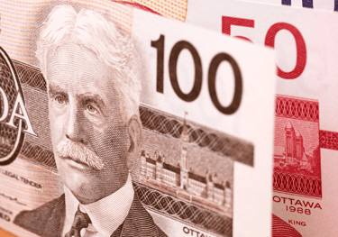 A close up of a Canadian bank note with a picture of a man