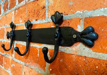 Sideview of metal coat rack attached to wall