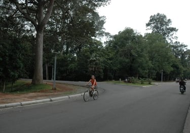 `Tracey Billington cycling at the Temples of Angkor, Siem Reap, Cambodia