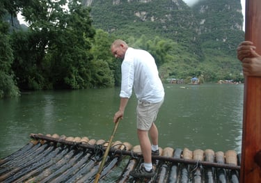 Nick Billington driving the raft at the Yulonghe scenic area, near Yangsh