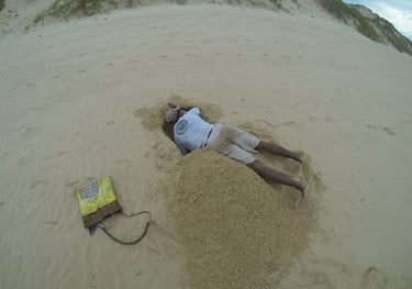 man digging for crustaceans at tofo Beach, Praia do Tofo, Mozambique