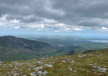 a view out to the sea from the summit of the Carnedds