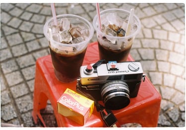 a camera and a film with two drinks