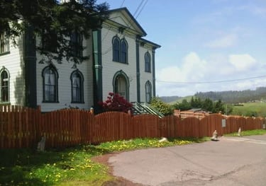 House with a fence and blue sky