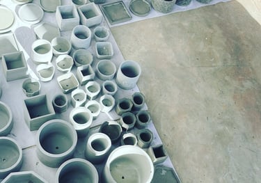 a bunch of different types of clay pots
