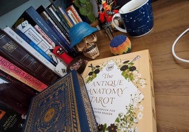 a book on a desk with a cup of coffee and a book