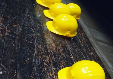 a row of yellow hard hats