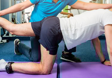 a man is doing a leg split in a gym