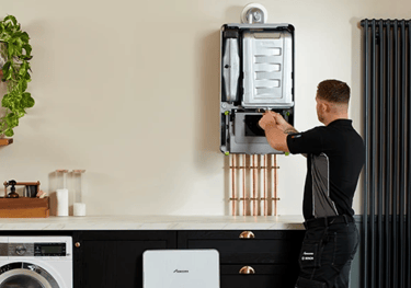 Technician performing a boiler service on a Worcester Bosch boiler, ensuring safety and efficiency
