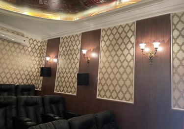 a cinema room with chandeliers and some cinema chairs